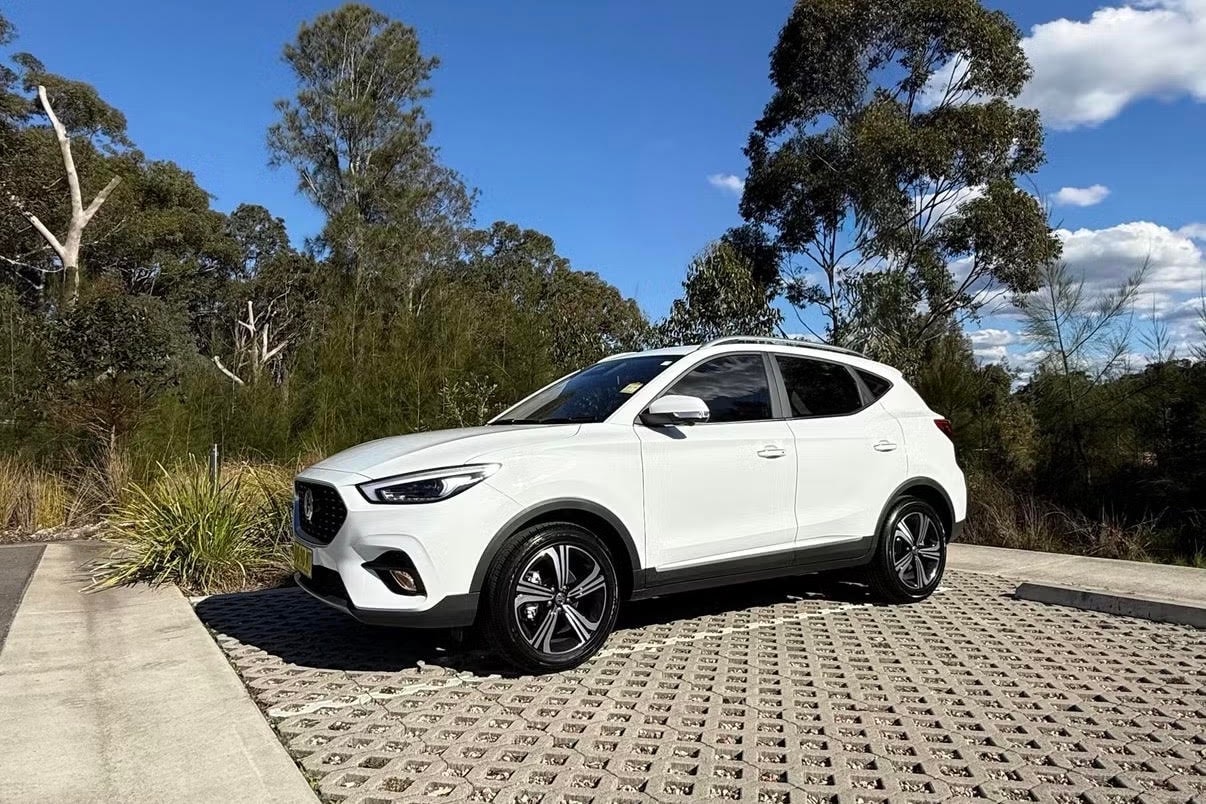 MG ZST SUV parked in eucalyptus forest — Luxroo rental fleet