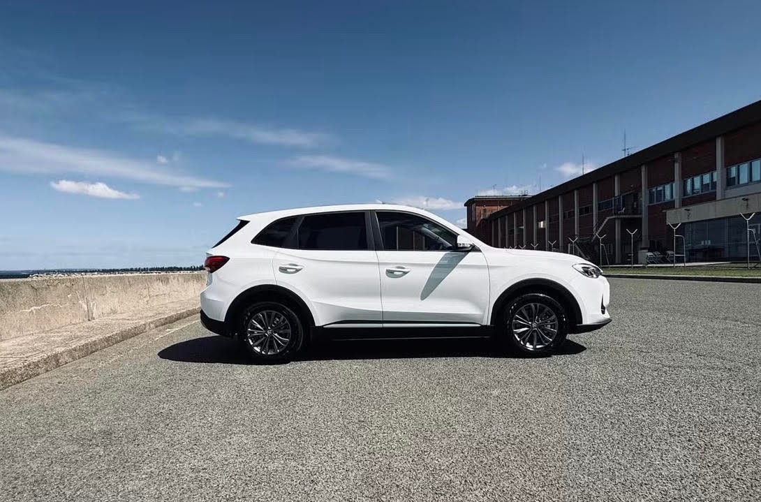 MG ZS SUV parked at industrial waterfront — Luxroo rental fleet