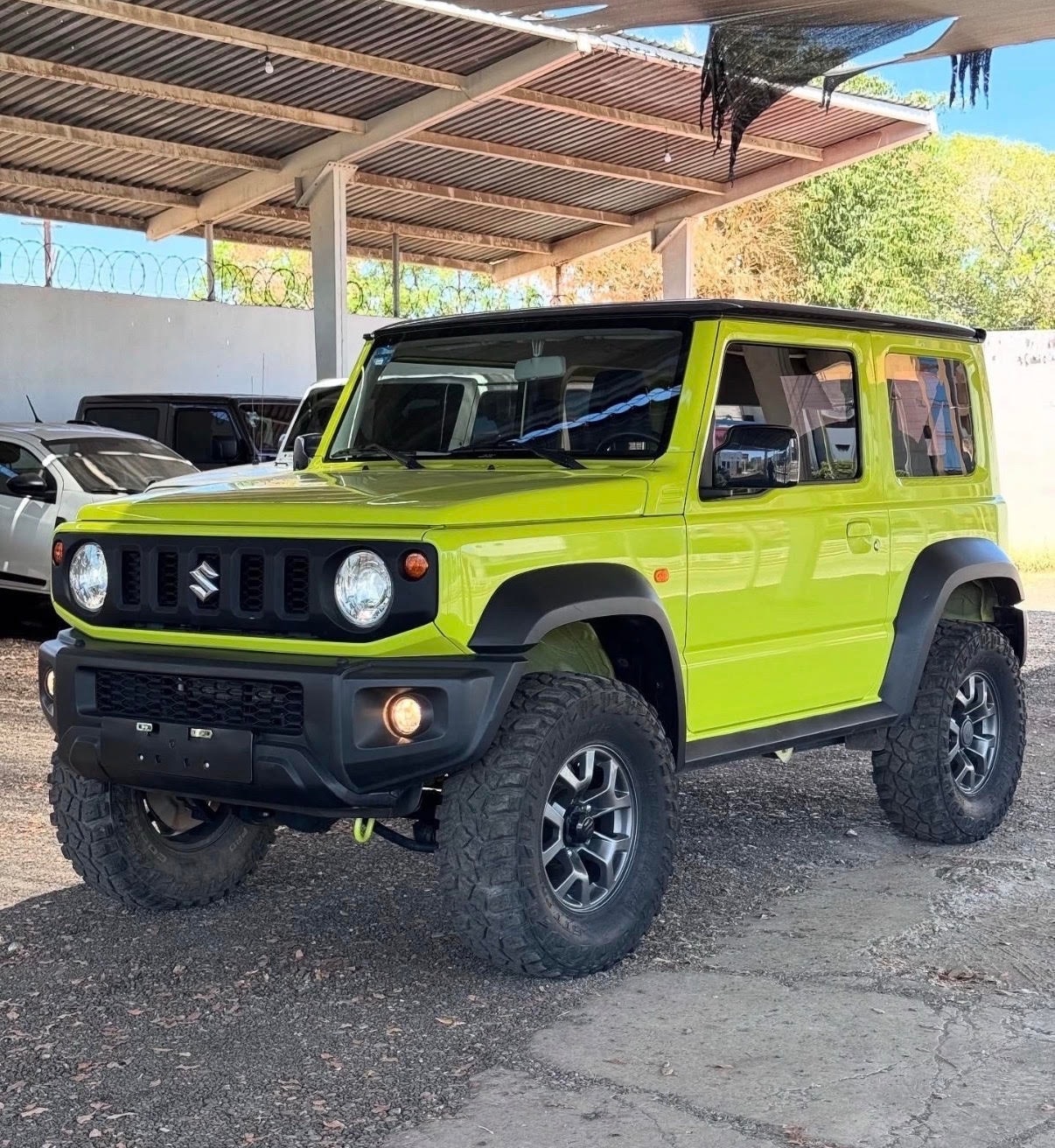 Suzuki Jimny compact SUV in yellow — Luxroo rental fleet